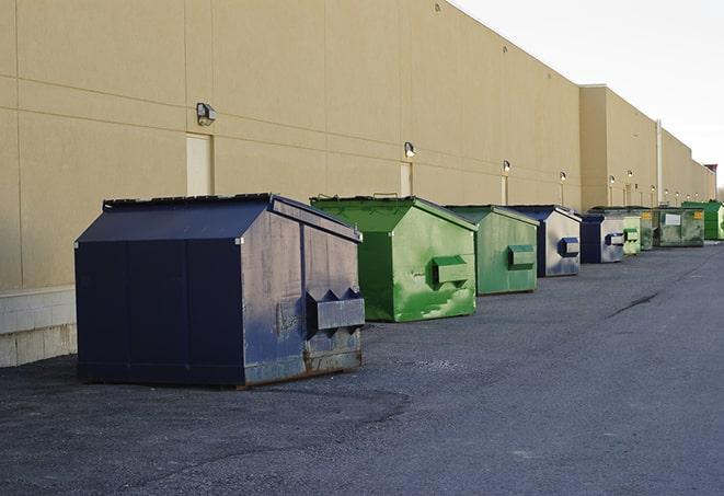 piles of waste and debris collected in construction dumpsters in Elida